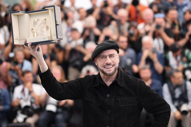 Cannes film festival: John Travolta is going all out to fit in with the locals. Photograph: Aurore Marechal/Getty Images