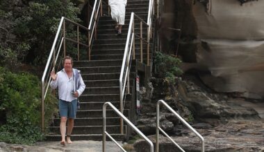 Sydney beachgoer crashes Australian Fashion Week runway mid swim