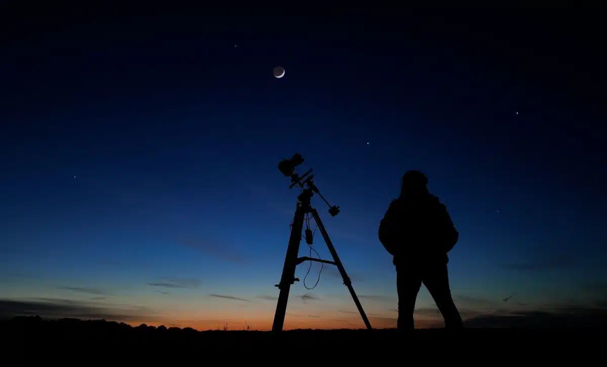 Rare Predawn Spectacle As The Crescent Moon, Mars And Saturn Rise Together Above The Horizon.