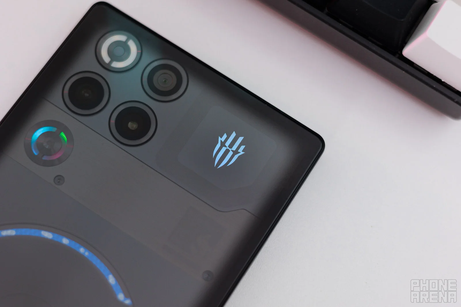 The RedMagic logo on the back lights up in any color you want. | Image by PhoneArena - RedMagic 11S Pro Review: Extreme performance, 7500 mAh battery!
