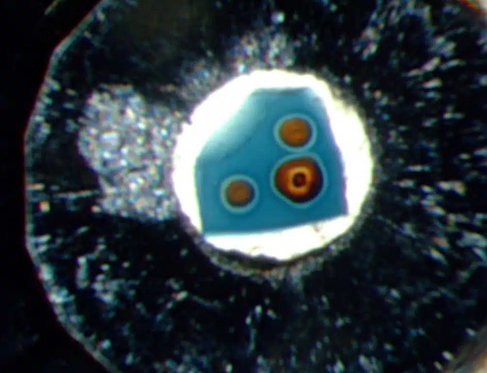Ringwoodite Crystal Under Pressure, Orange Circles Show Released Water.
