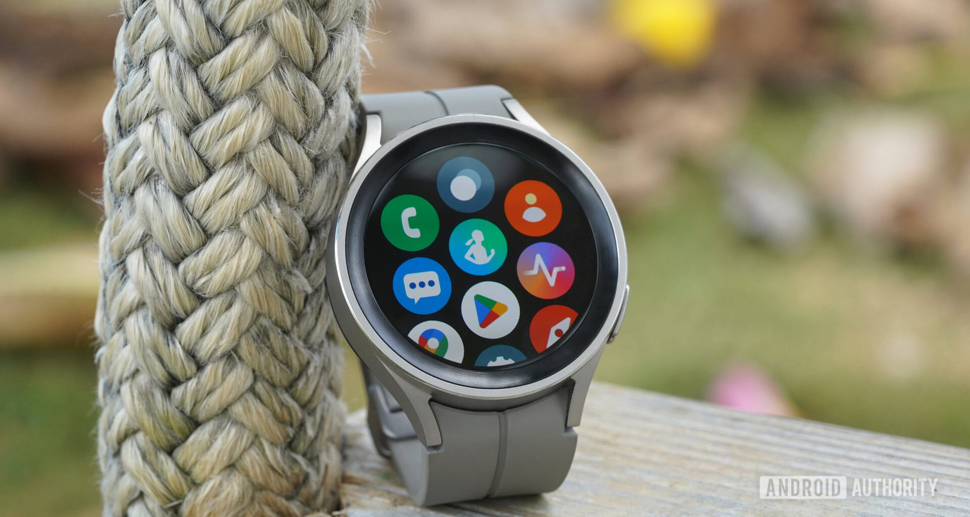 A Samsung Galaxy Watch 5 Pro displays its App Library including Google and Samsung native apps.