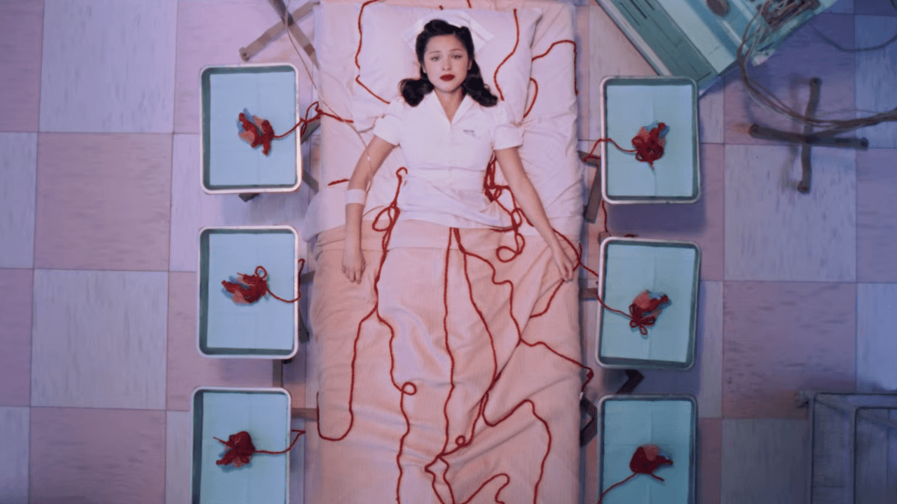 Watch Olivia Rodrigo Unravel in New “The Cure” Video
