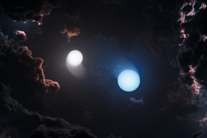 An artist's impression of two young stars dancing together in their Orion Nebula birthplace. They're hidden by clouds of gas and dust but radio telescopes can pierce those clouds to allow astronomers to study them in detail. Courtesy NSF/VLBA/NRAO