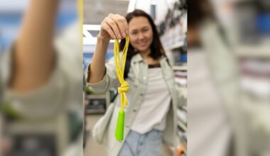 Woman holds up jump rope in store
