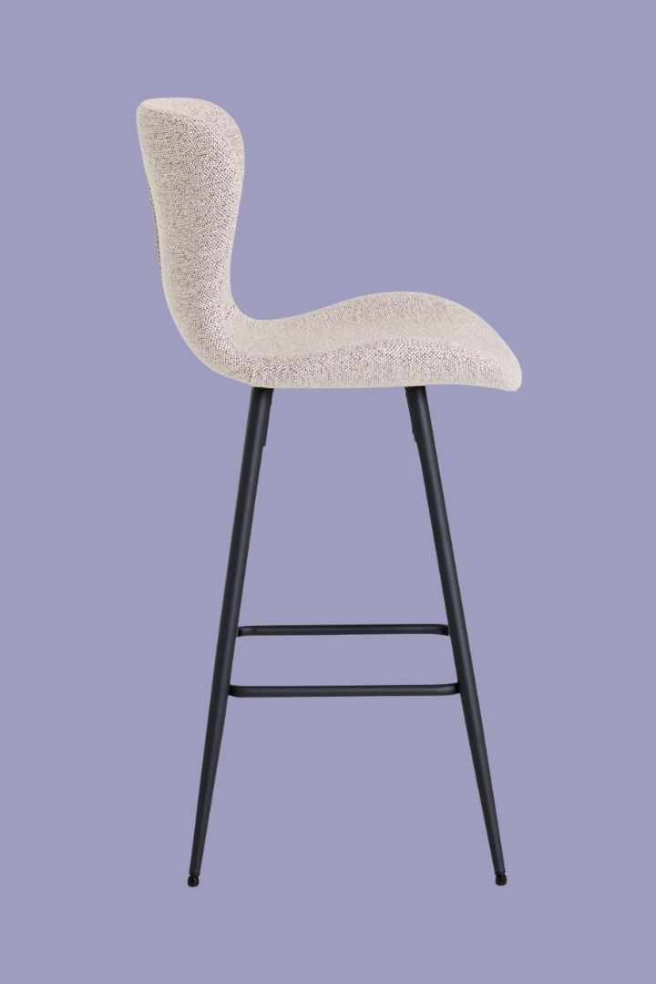 Pair of 2 Etta Fabric Bar Stools against lilac background seen in profile.