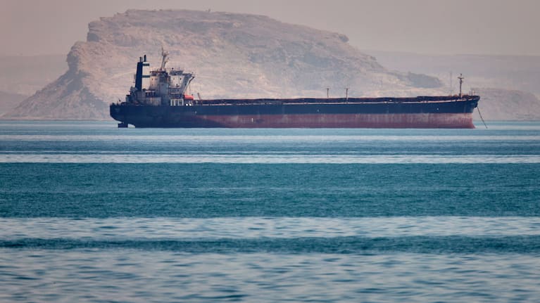 A bulk cargo ship sits at anchor in the Strait of Hormuz off Bandar Abbas, Iran, Saturday, May 2, 2026.