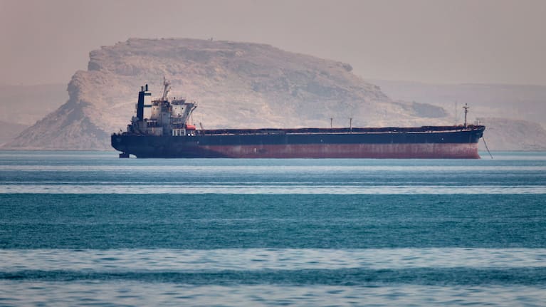 A bulk cargo ship sits at anchor in the Strait of Hormuz off Bandar Abbas, Iran, Saturday, May 2, 2026.