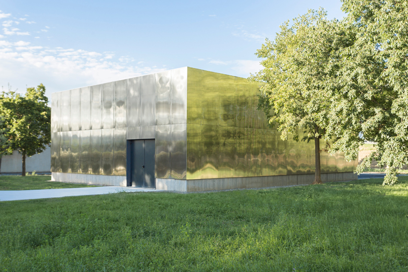 mirrored aluminum facade blurs distretto solidale social space into the italian landscape - 2