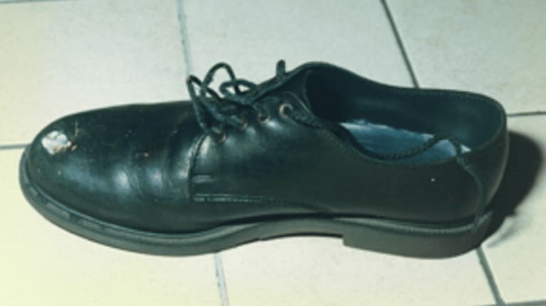 A shoe damaged after a bullet ricocheted. (Source: Victoria Police)