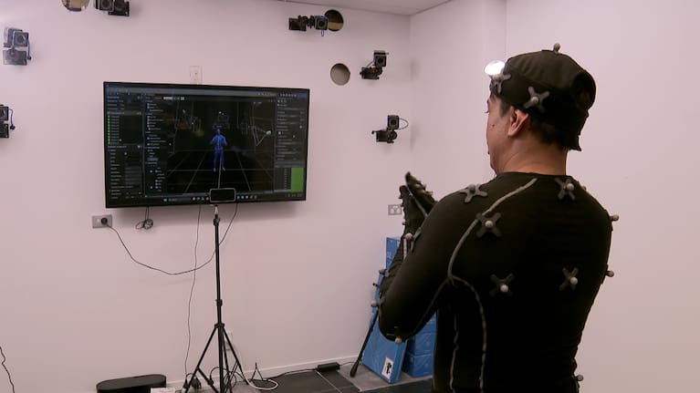 A signer wearing a motion capture suit.