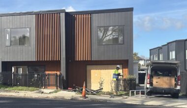 Teen arrested after car crashes into newly-built Auckland townhouse