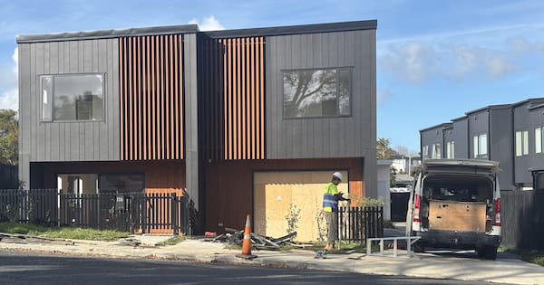 Teen arrested after car crashes into newly-built Auckland townhouse