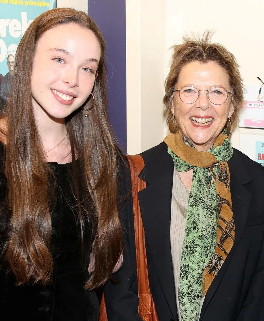 Ella Beatty in a black buttoned cardigan and mother Annette Bening in a silk top, navy jacket and two colourful scarves.