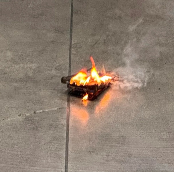 An image of a Galaxy S24 engulfed in flames after a user states it swelled before combusting during "normal use."