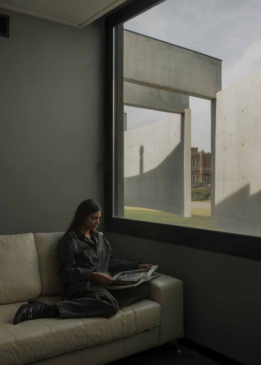 Casa Alba by Ademas Arquitectura, a concrete house with a wall for privacy