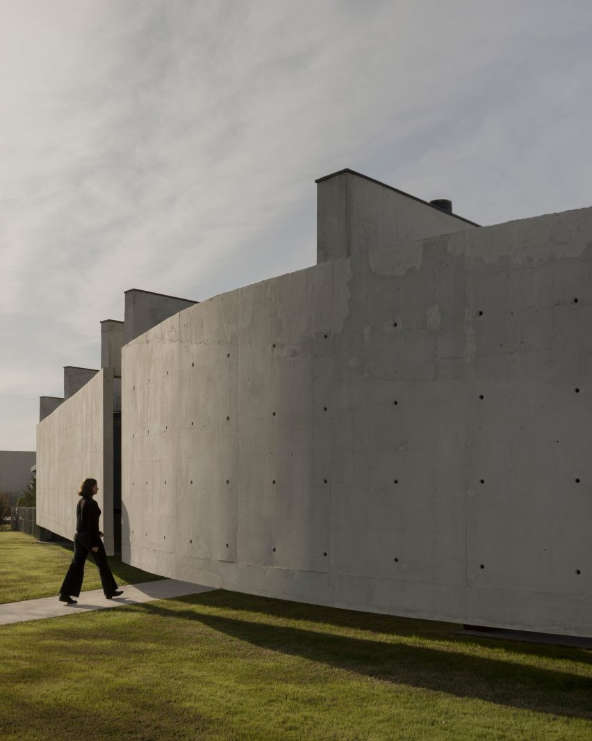 Casa Alba by Ademas Arquitectura, a concrete house with a wall for privacy