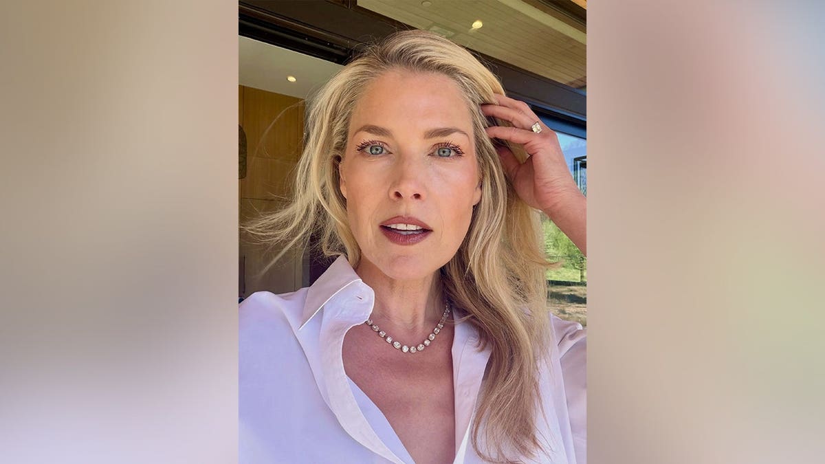 Ali Larter looking into the camera with her hand in her hair in May 2026.