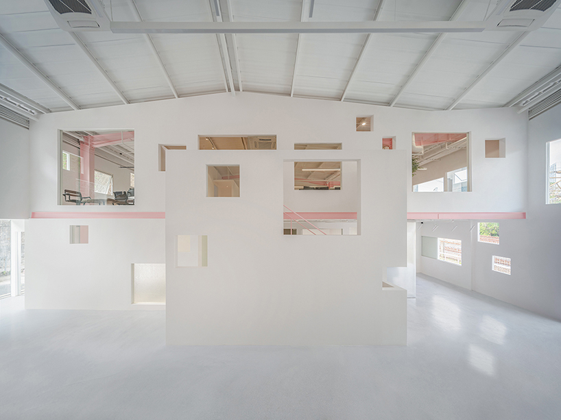 layered transparent walls transform former railway warehouse in shenzhen - 5