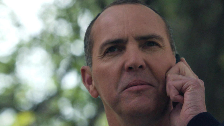 Arnold Vosloo as Jacob Broadsky talks on a phone in Bones