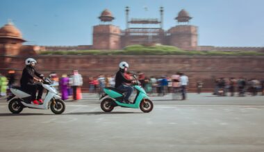 Electric scooters in front of the Red Fort, Delhi