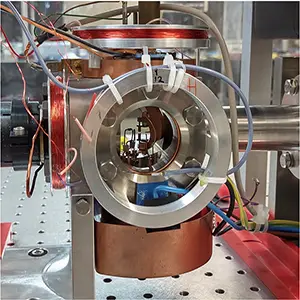 Pictures of the components used in making an atomic clock. The ion trap (left image) holds the clock in place. The optical/laser apparatus (right images) measures the clock’s frequency. Credit: Kyushu University/Colorado State University/Christian Sanner