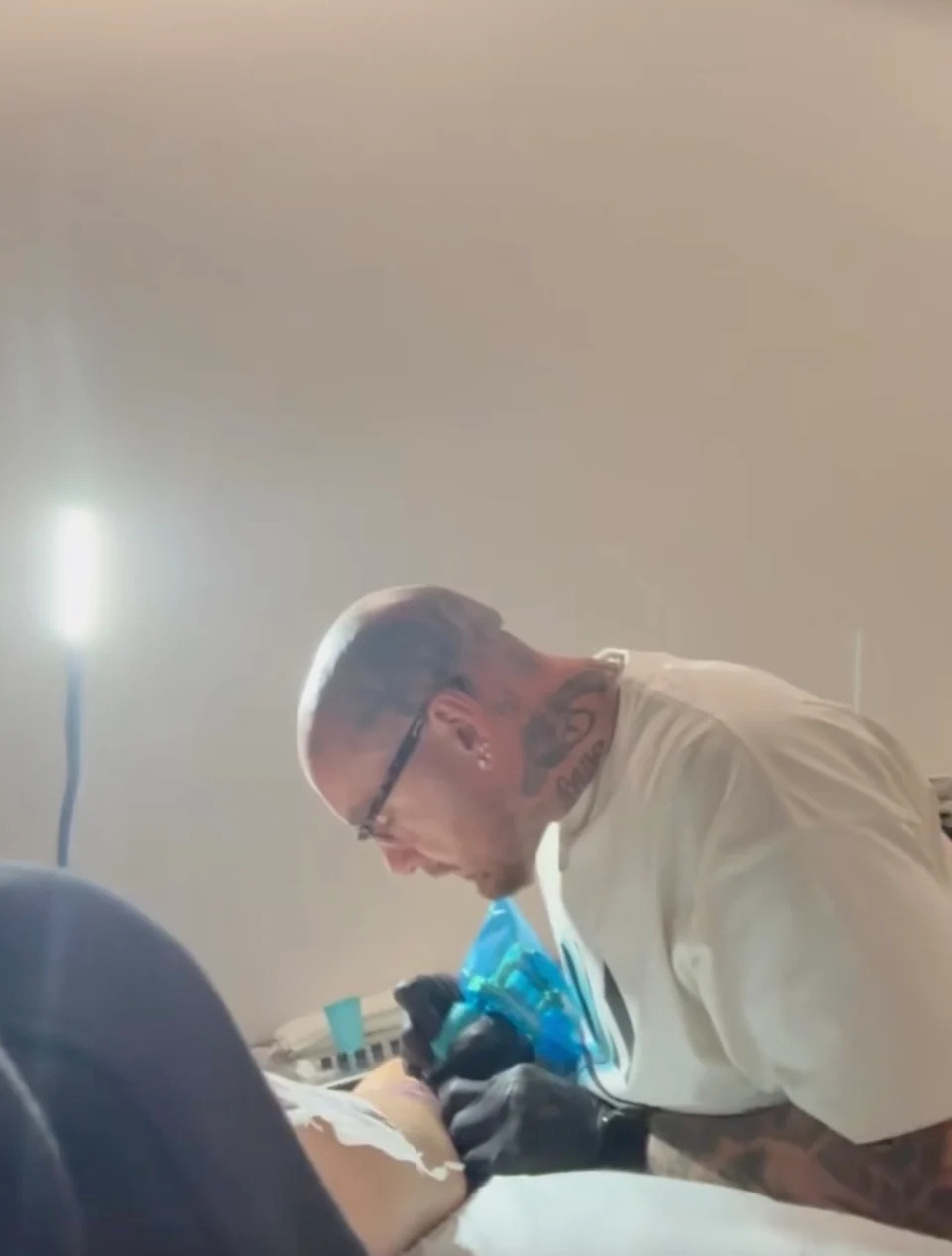In the background, Bang Bang (Kevin McCurdy, above) was seen at work on her leg. bangbangnyc/ instagram
