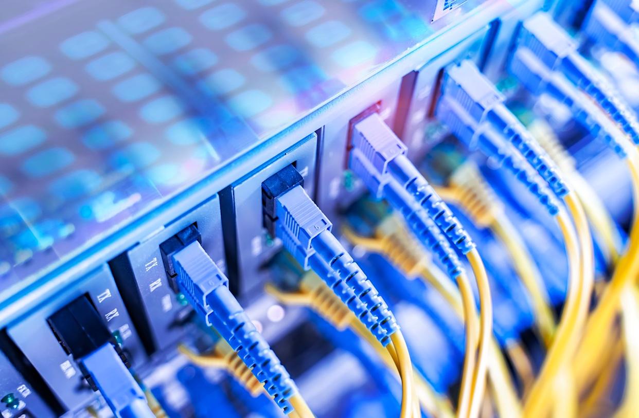 Blue and yellow cables plugged into servers.