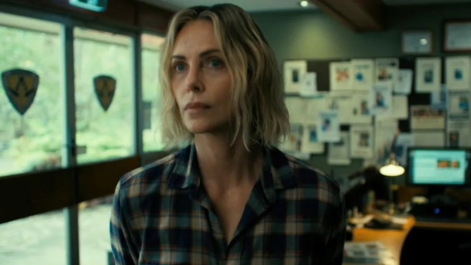 Charlize Theron looking slihgtly concerned in Apex. .