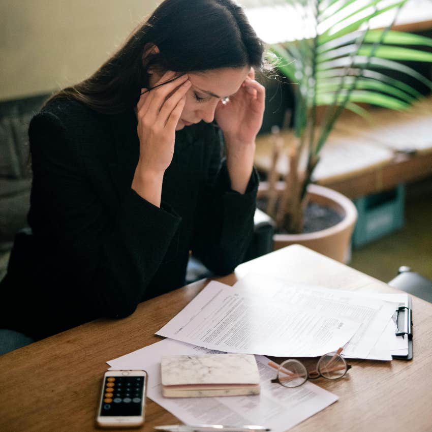 business woman stressed about money