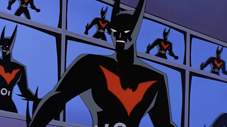 Terry McGinnis' Batman of the future stands in front of a wall of TV screens, all showing a live image of him, on Batman Beyond.
