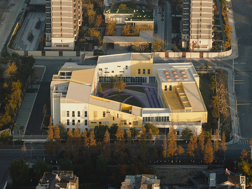 stacked color blocks and layered courtyards form a modular castle-like kindergarten in china - 1