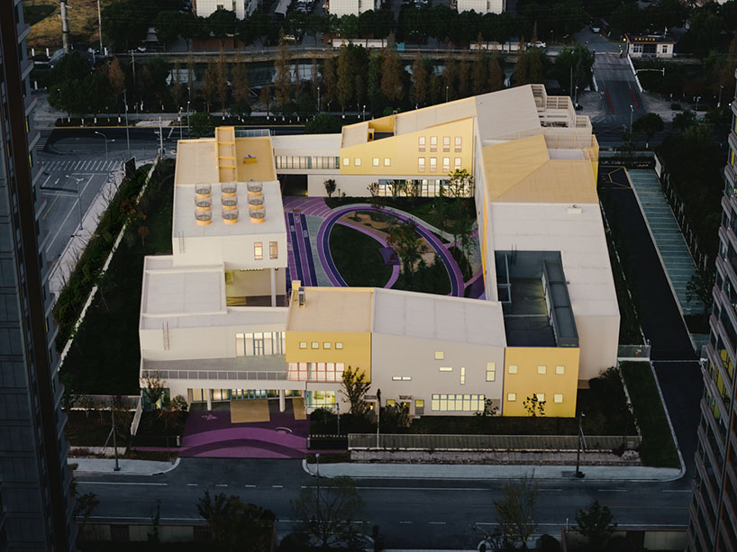 stacked color blocks and layered courtyards form a modular castle-like kindergarten in china - 4