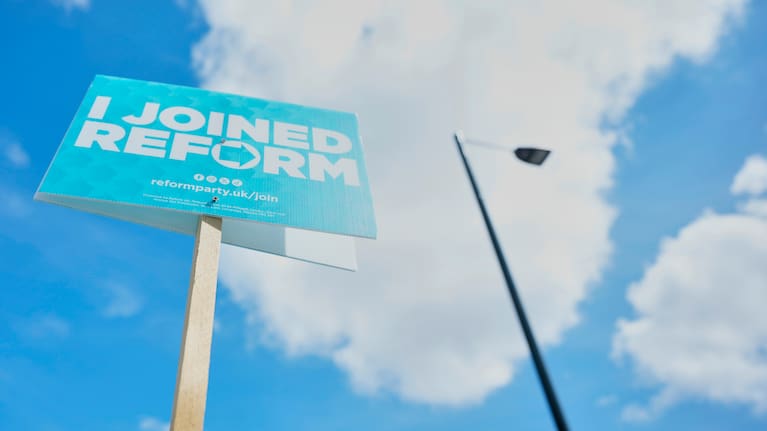 A Reform UK political sign put up by the householder to show support ahead of local council elections in London