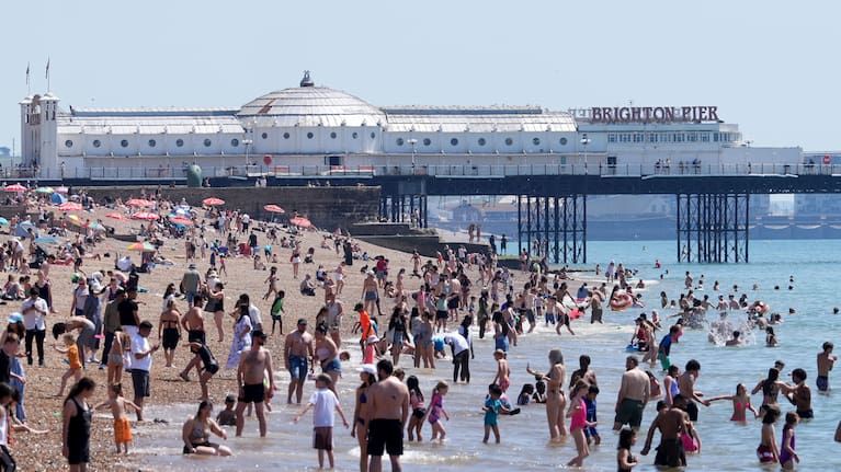 People enjoying the beach in Brighton, East Sussex, England.
