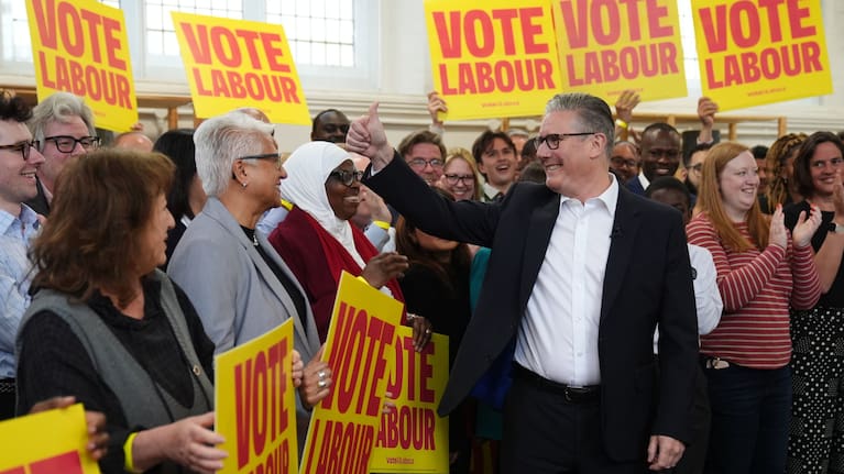 Britain's Prime Minister Keir Starmer gestures to supporters during a visit to All Saints Hall in south London, Tuesday May 5, 2026, whilst campaigning for the upcoming local elections