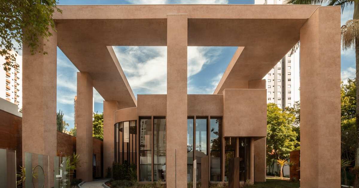 monochromatic concrete geometry shapes temporary pavilion in são paulo