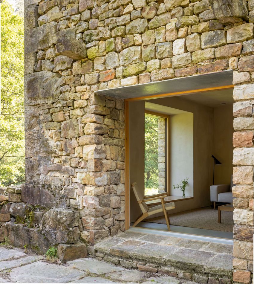 vernacular stone cabin in northern spain gains a renewed layered inner envelope - 3