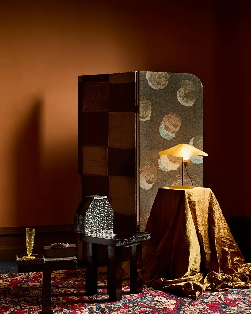 An orange room featuring objects all stacked against each other