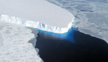 A view from above of a large glacier in the ocean