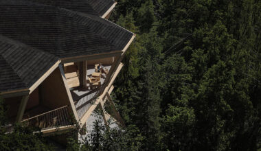 fragmented timber volumes compose forested mountain housing by arup in albania