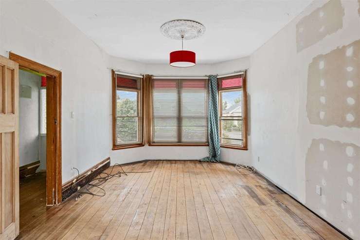 A three-bedroom villa on Corson Avenue, in Beckenham, Christchurch, was sold under the hammer for <img.305m, shattering expectations by more than $200,000. Photo / Supplied