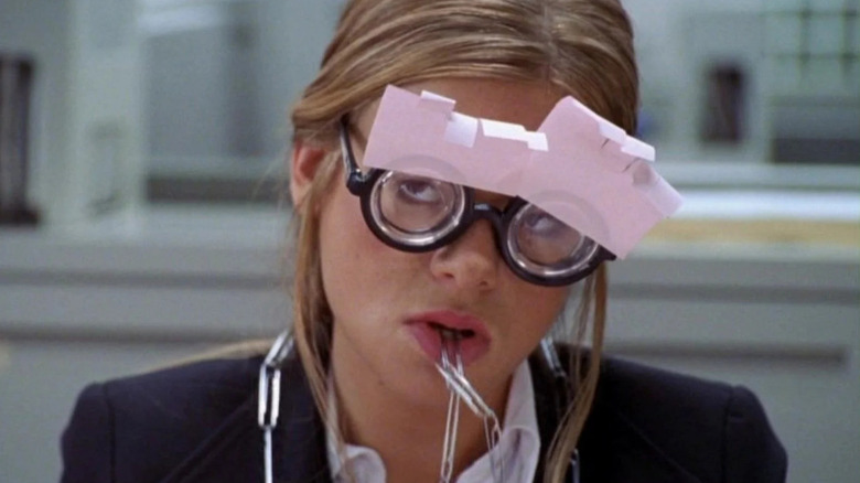 Ellen Muth as Georgia wearing glasses covered in sticky notes and chewing on paper clips in Dead Like Me