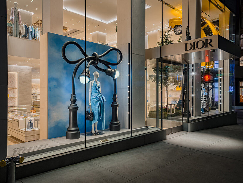 alex chinneck twists NYC taxis and LA cars into storefront sculptures for dior - 4
