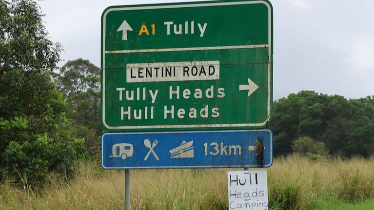 Directional sign pointing towards Tully, Tully Heads and Hull Heads on the Bruce Highway in Queensland.
