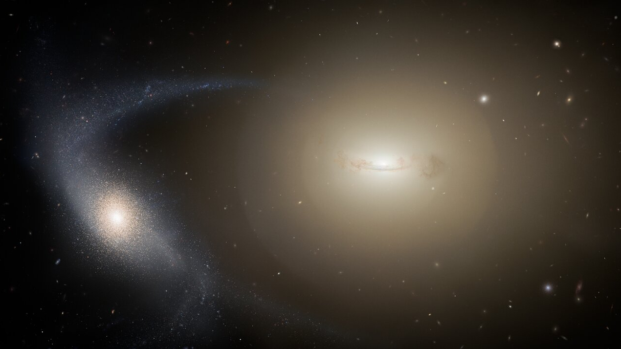 two white spirals on a black, starry background converge into one