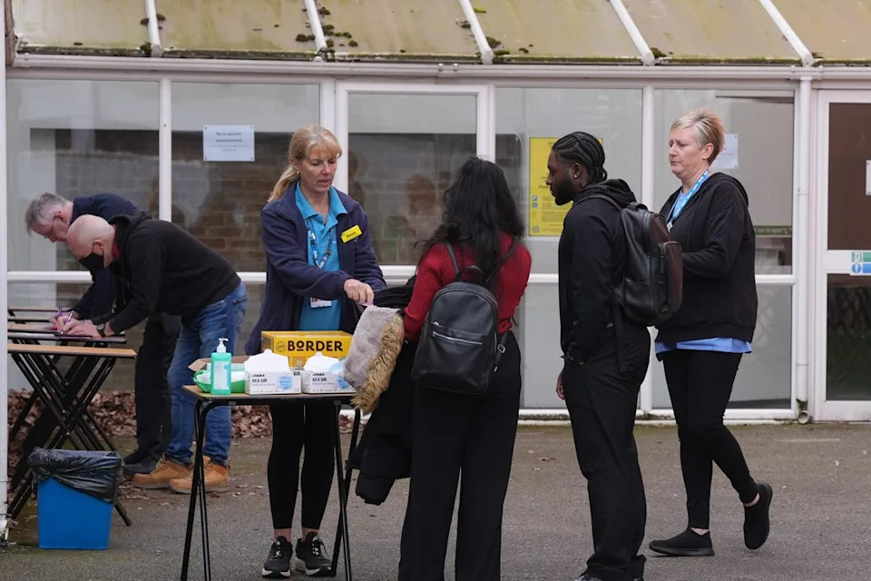 People queuing to receive vaccines and antibiotics at the University of Kent campus in Canterbury in March (PA)