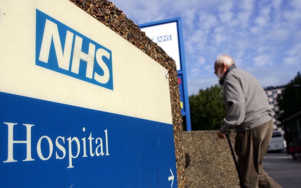 Elderly gentleman walking to NHS hospital