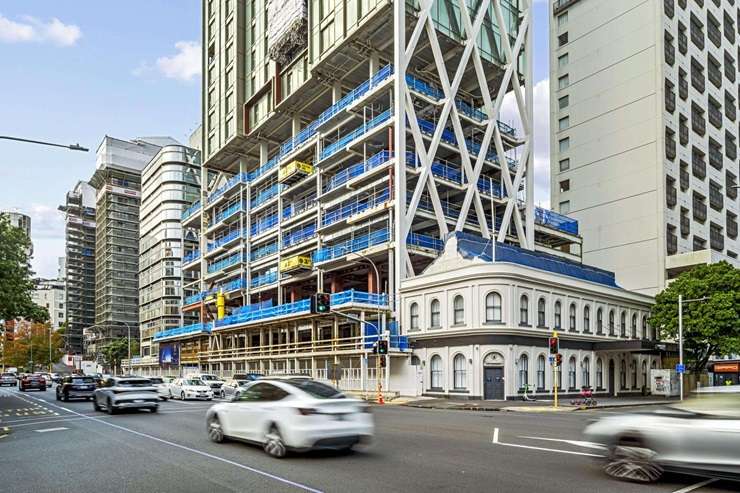 The partially built Seascape apartment tower, left, in Auckland CBD is looking for a new owner. Photo / Michael Craig