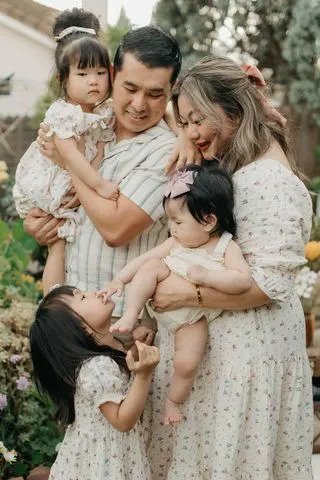 Kristine Xiong with her husband and three kidsCredit: Kristine Xiong